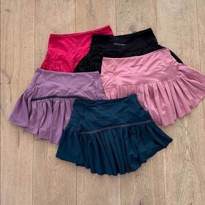 3 Gold Hinge Skirts with shorties, 2 off brand in Assorted Colors. All XS.